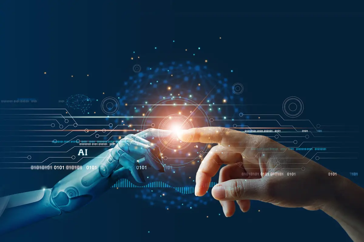 Human and robotic hands connecting, symbolizing AI-driven digital transformation
